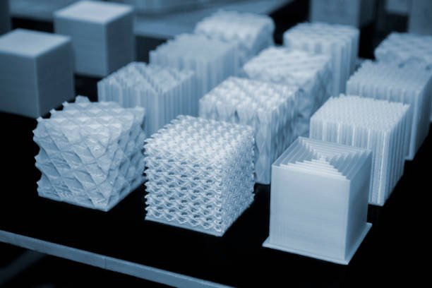 Objects printed on 3d printer made of white plastic close-up. Models created on 3D printer from filament. Modern new prototyping technology. Additive automation manufacturing Fused deposition modeling